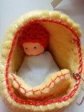 Felt bassinet with baby